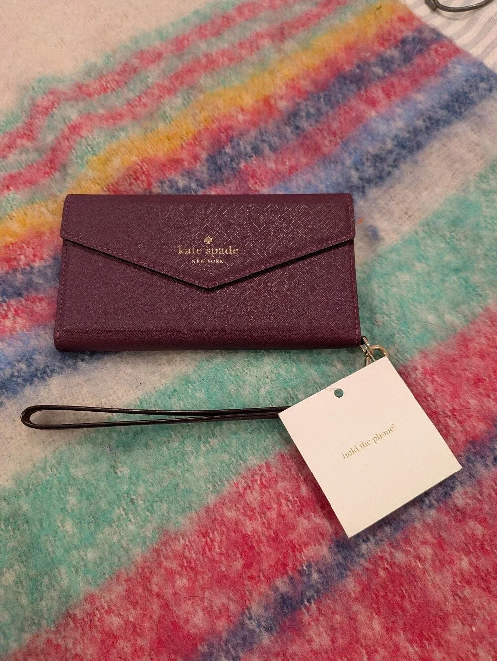 kate spade Plum Leather Wristlet Phone Case with Gold Logo